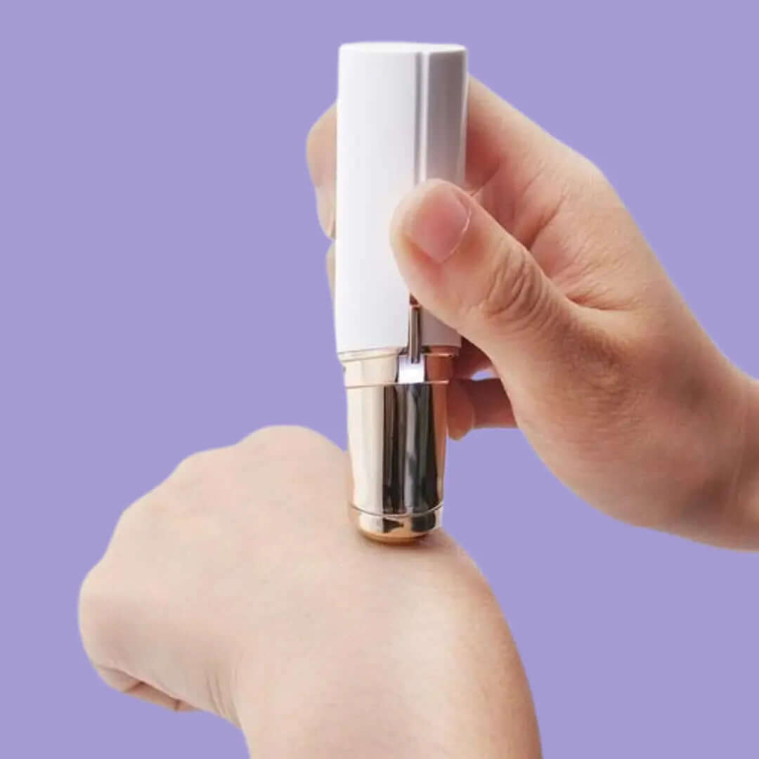 Gleame pain-free facial hair removal tool held close to skin on hand for gentle hair removal